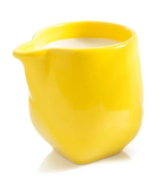 Milk in jug  on white Stock Photos
