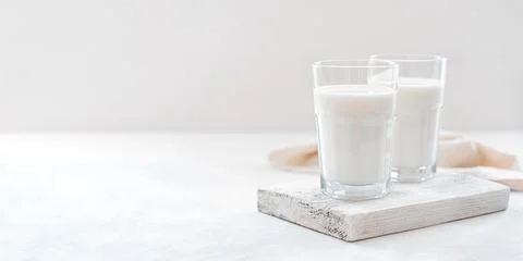 Milk on a light background with space to copy. Stock Photos