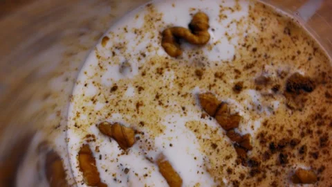 Milk, nuts, ground cinnamon and brown sugar are placed together in the blender Video stock 331636989