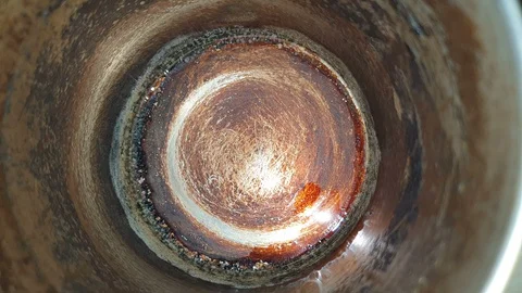 Milk or white liquid pouring in to dirty cup Video stock 129346089