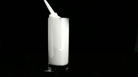 Milk overflowing in super slow motion 库存影片 10859893