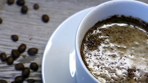 Milk From Pack Poured Into White Cup Of Black Coffee. Video stock 116562249