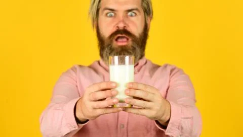 Milk Pasteurization in Dairy Processing Plant. selective focus. surprised man Stock Photos