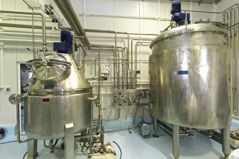 Milk pasteurization Interior of dairy factory with fermentation tank ,prop... Stock Photos
