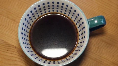 Milk pour into coffee Stock Footage 115395192