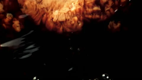 Milk is poured into black coffee. Macro background. Filmed is slow motion 1000 Vidéo 167797489