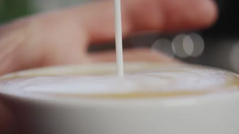 Milk poured into coffee cup Stock Footage 274685561