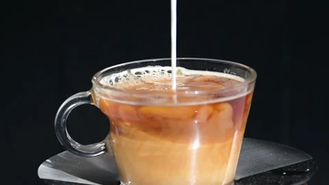 Milk poured into coffee Stock Footage 250315518