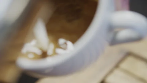 Milk poured into coffee Stock Footage 274686715