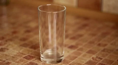 Milk poured into a glass Stock Footage 65610476