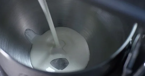 Milk poured in a Kneading Machine 4K Stock Footage 79263444