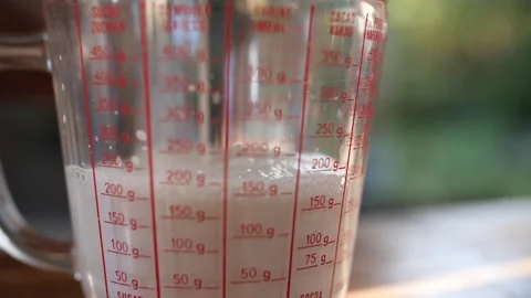 Milk Poured Into Measuring Cup, HD Stock Footage 148191608