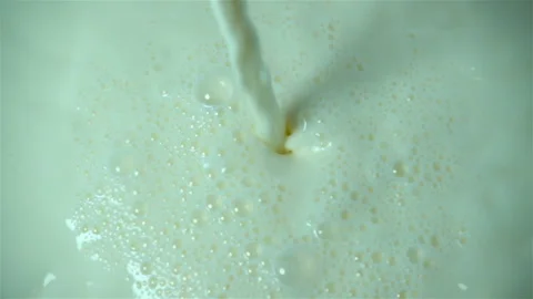 Milk is poured in slow motion Stock Footage 140256844