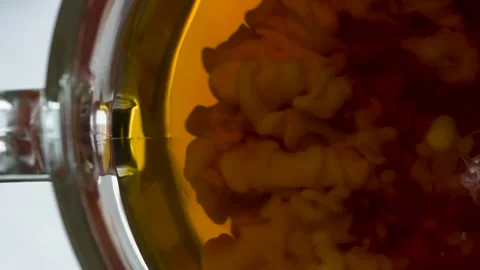 Milk is Poured Into Tea 4K Stock Footage 173156725