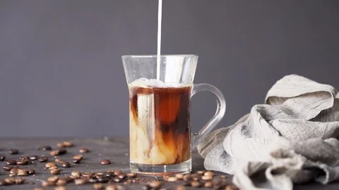 Milk Pouring and Mixing in Ice Coffee Stock Footage