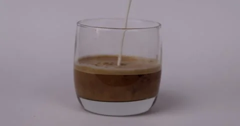 Milk Pouring into Coffee Stock Footage 280111036