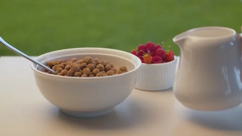 Milk pouring into corn flakes Stock Footage 137627045