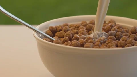 Milk pouring into corn flakes Stock Footage 139649706
