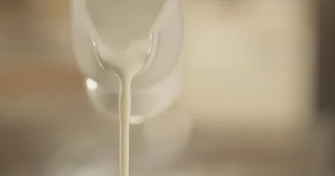 Milk pouring from a jug Stock Footage 200256823