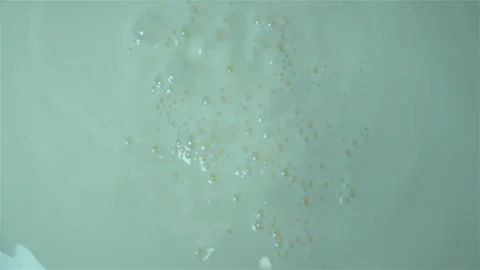 Milk is pouring in slow motion as a background. Stock Footage 134477235