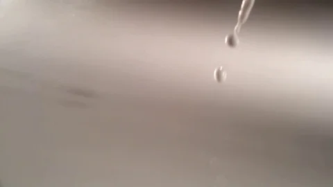 Milk pouring in slow motion Stock Footage 81231595