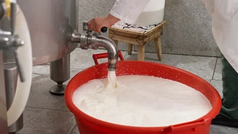 Milk is pouring from the tank Stock Footage 327974893