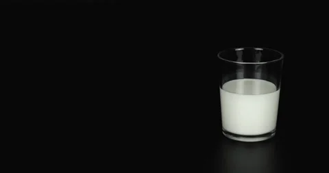 Milk Pouring will continuously increase in the glass, 4K food Stop motion. Stock Footage 136210945