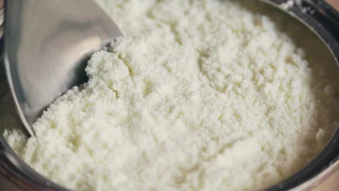 Milk Powder Serving with Spoon Stock Footage 158825369