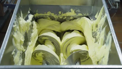 Milk processing, butter production at a dairy factory. Thick butter from a metal Video stock 263218132