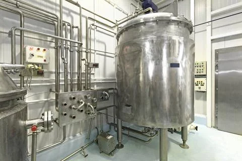 Milk Processing Plant Milk Pasteurization Tank and Pipes in Dairy Factory ... Stock Photos