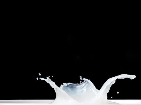 Milk Splash on black background. Stock-Fotos