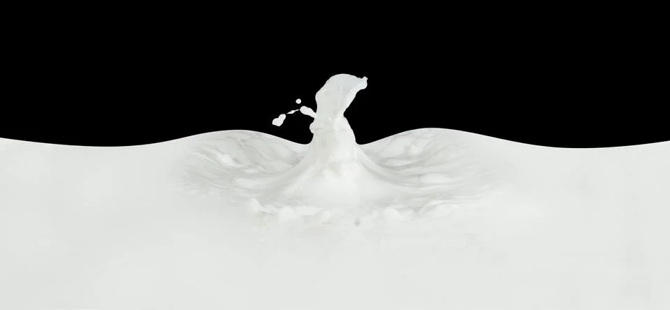 Milk splash Stock Photos