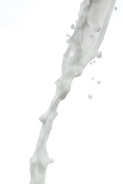 Milk splash on white background Stock Photos