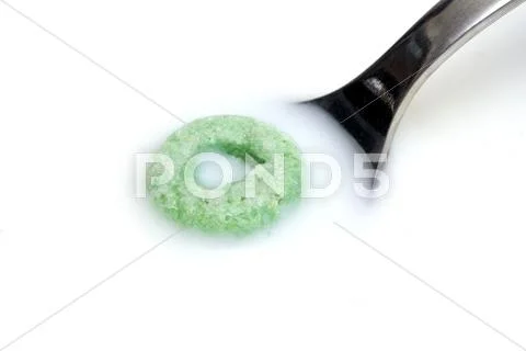 Milk spoon and cereal Stock Photos