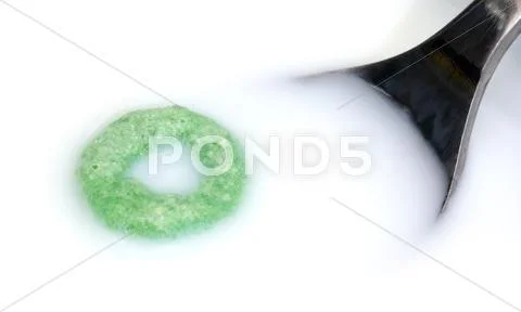 Milk spoon and cereal Stock Photos