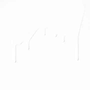 Milk streams on a white background . Stock Photos