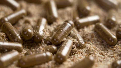 Milk Thistle supplement capsules with falling herbal extract powder Stock Footage 269906787