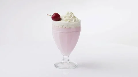 Milkshake with cream and cherry Stock Footage