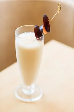 Milkshake with fresh plums Stock Photos