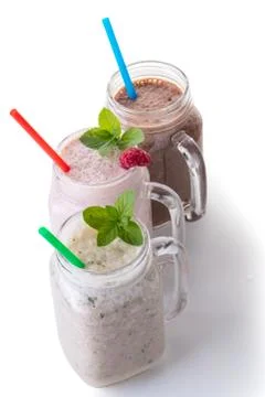 Milkshake in jar with a straw Stock Photos