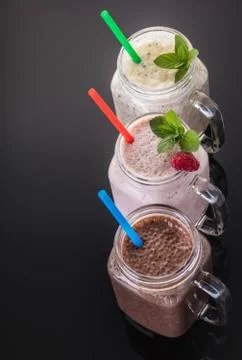 Milkshake in jar with a straw Stock Photos