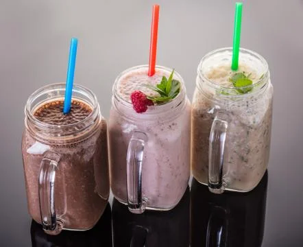 Milkshake in jar with a straw Stock Photos