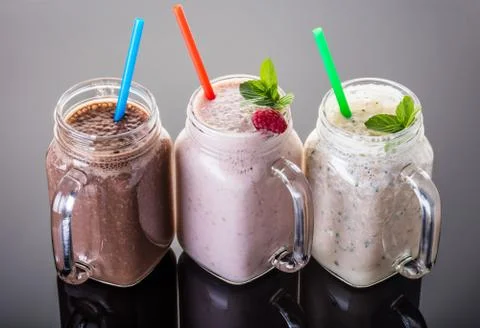 Milkshake in jar with a straw Stock Photos