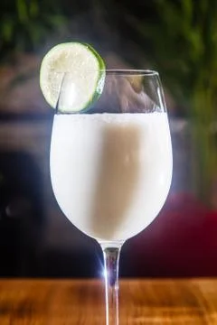 Milkshake with lime in a glass. Stock Photos