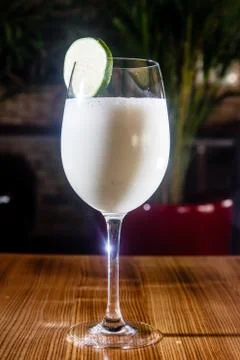 Milkshake with lime in a glass. Stock Photos