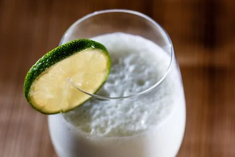 Milkshake with lime in a glass. Stock Photos