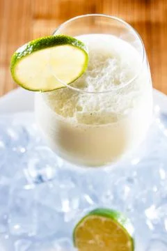 Milkshake with lime in a glass. Stock Photos