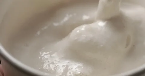 Milkshake macro rotating studio 4K Video stock 144800098