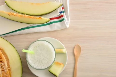 Milkshake with melon and fruit on table with fruit top Stock Photos