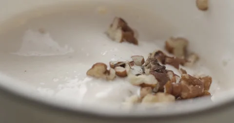 Milkshake with nuts macro rotating studio 4K Stock Footage 144800246